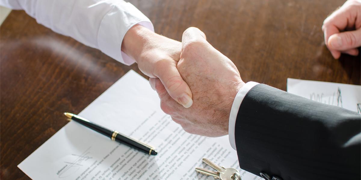 Shaking Hands with contract and keys